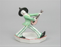 Appraisal: Sitzendorf Porcelain Figurine An amusing Sitzendorf Porcelain figurine in a