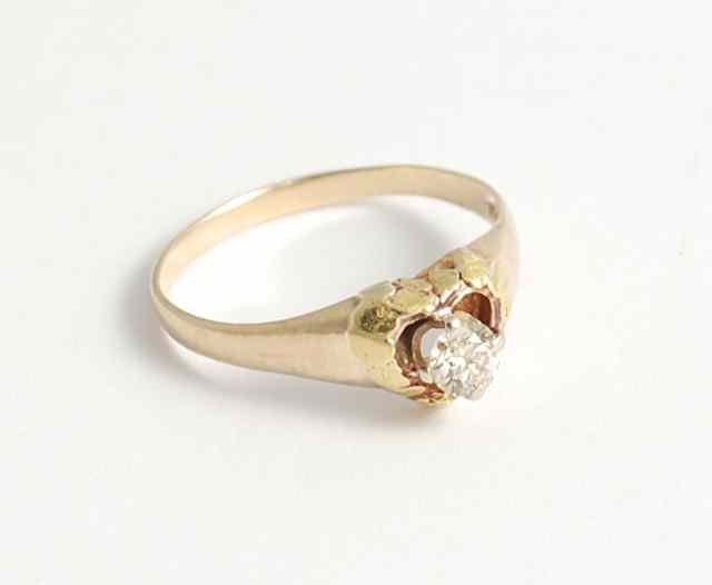 Appraisal: DIAMOND AND FOURTEEN KARAT GOLD SOLITAIRE RING centering a round