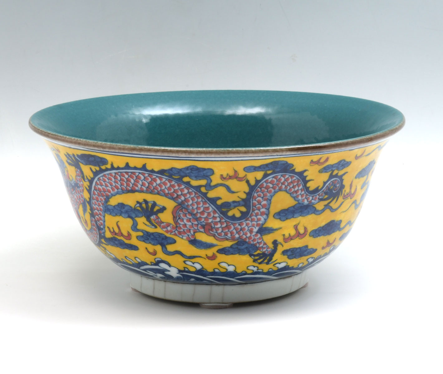 Appraisal: YELLOW GROUND CHINESE DRAGON BOWL Hand thrown Chinese porcelain bowl