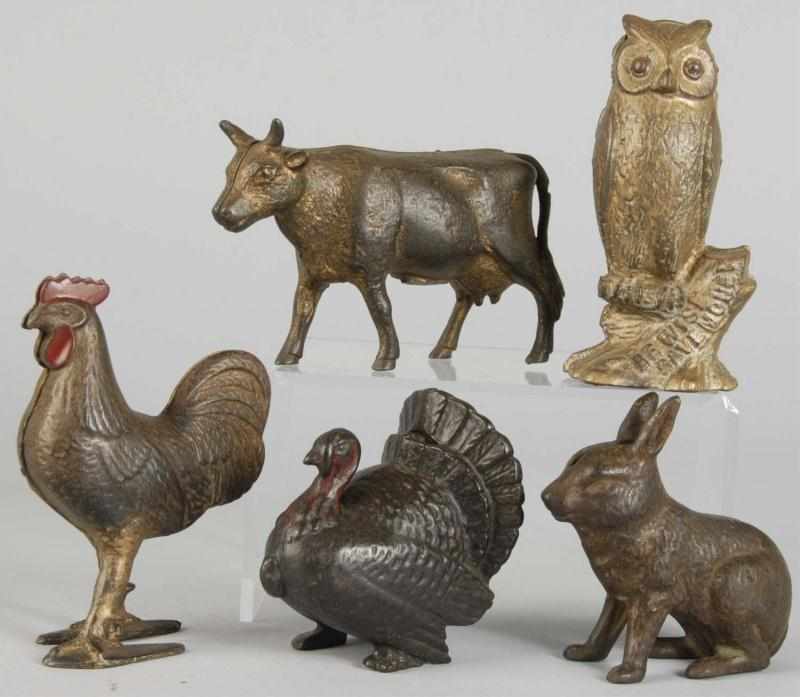 Appraisal: Lot of Cast Iron Still Banks Description Includes cow owl