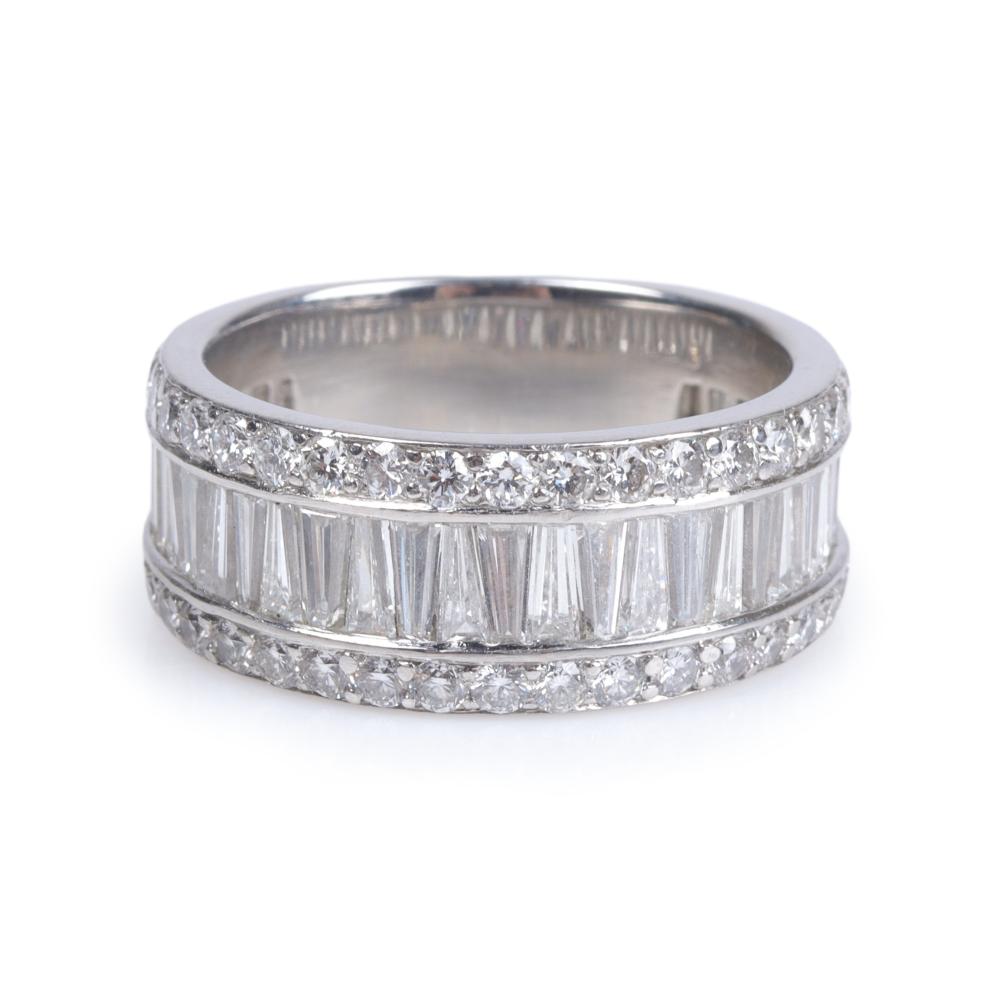 Appraisal: Platinum estate diamond band ring containing tapered baguette diamonds estimated