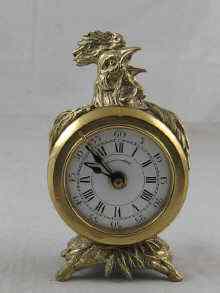 Appraisal: A brass German alarm clock with cast cockerel finial approx