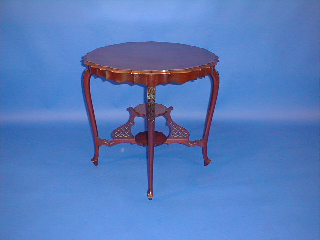 Appraisal: A late Victorian mahogany window table with pie-crust edge pierced