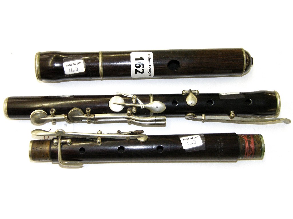 Appraisal: English rosewood flute by Jules Riviere Hawkes circa stamped Riviere