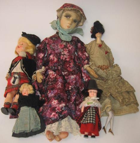 Appraisal: A boudoir doll with painted fabric face and flowered dress