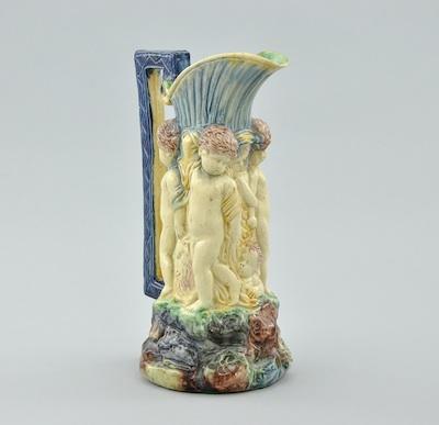 Appraisal: A Majolica Cherub Pitcher Charmingly decorated in cobalt blue green