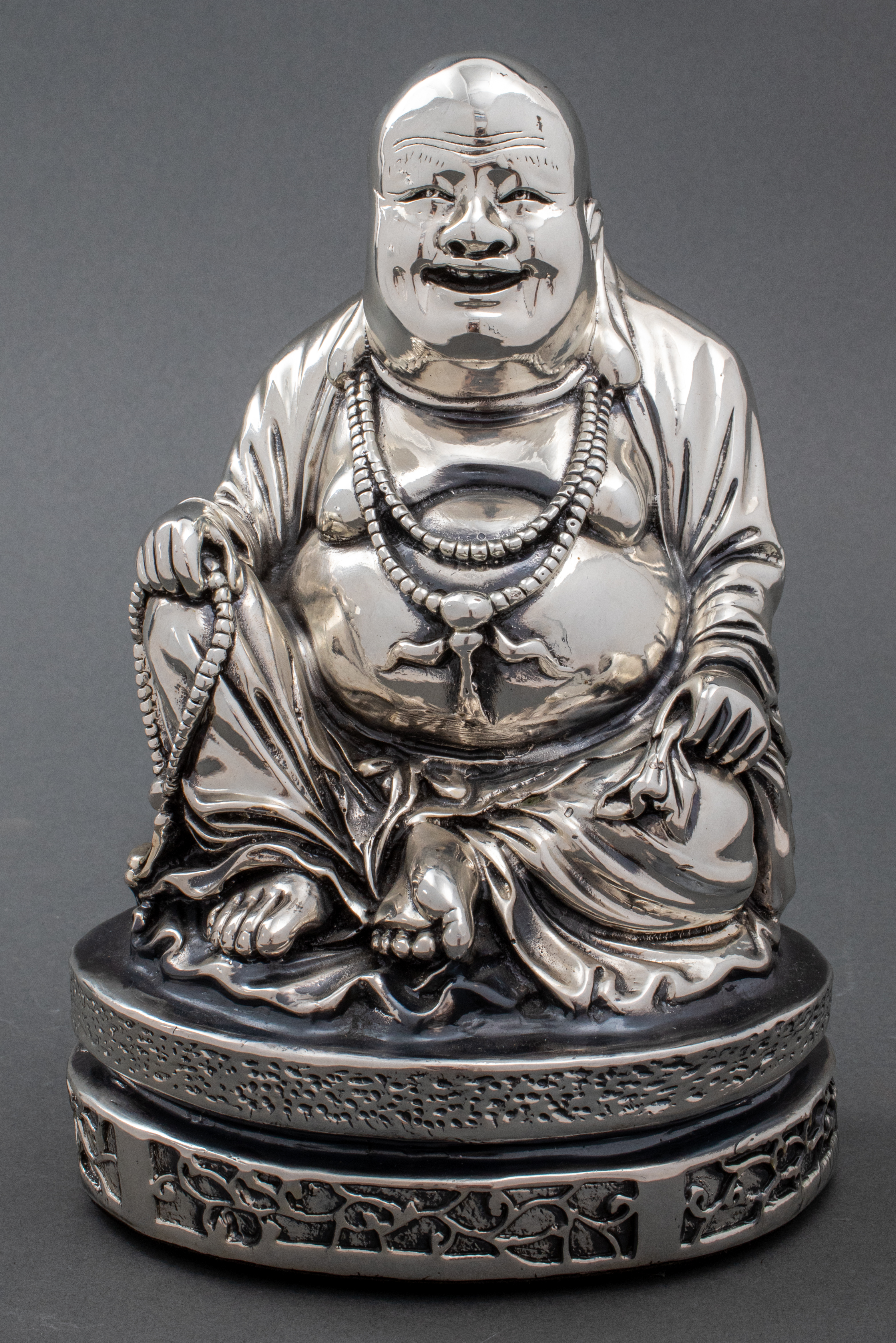 Appraisal: SILVERPLATE LAUGHING BUDDHA FIGURINE Silverplate Laughing Happy Buddha figure unmarked