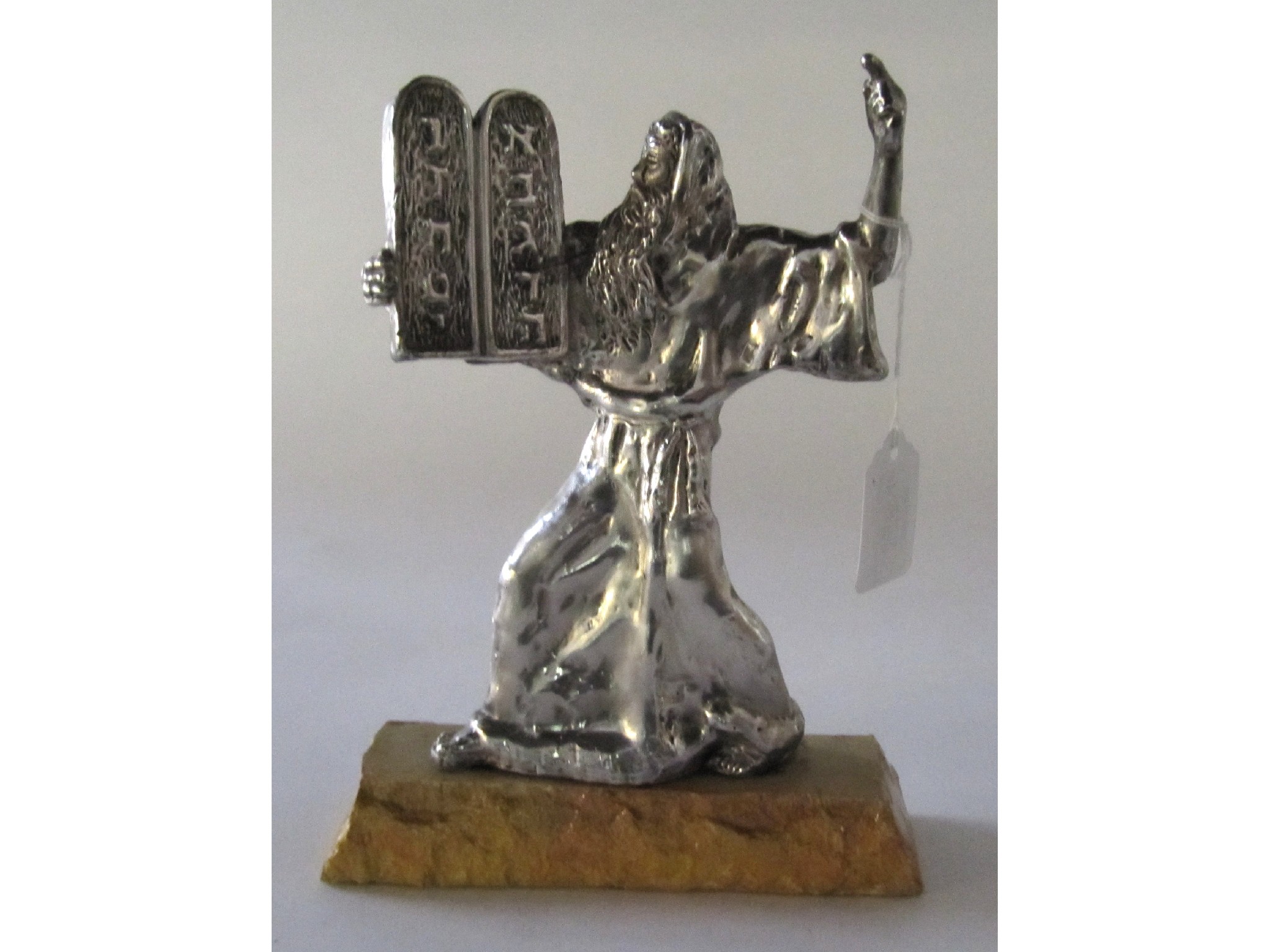 Appraisal: A sterling silver figure of Moses with the commandment tablets