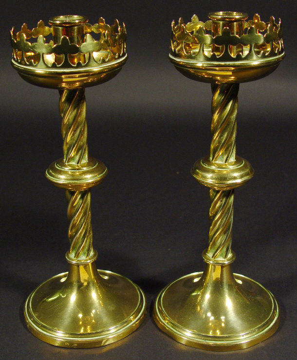 Appraisal: Pair of Victorian brass candlesticks with club design pierced drip