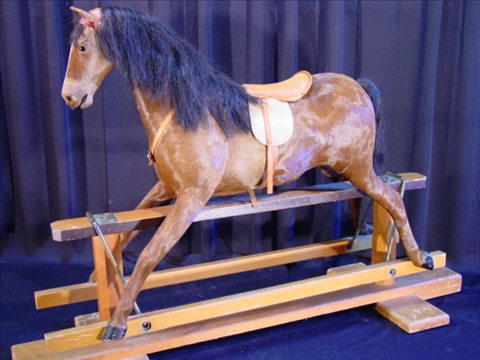 Appraisal: HORSE HIDE AND HAIR HOBBY HORSE with glass eyes and