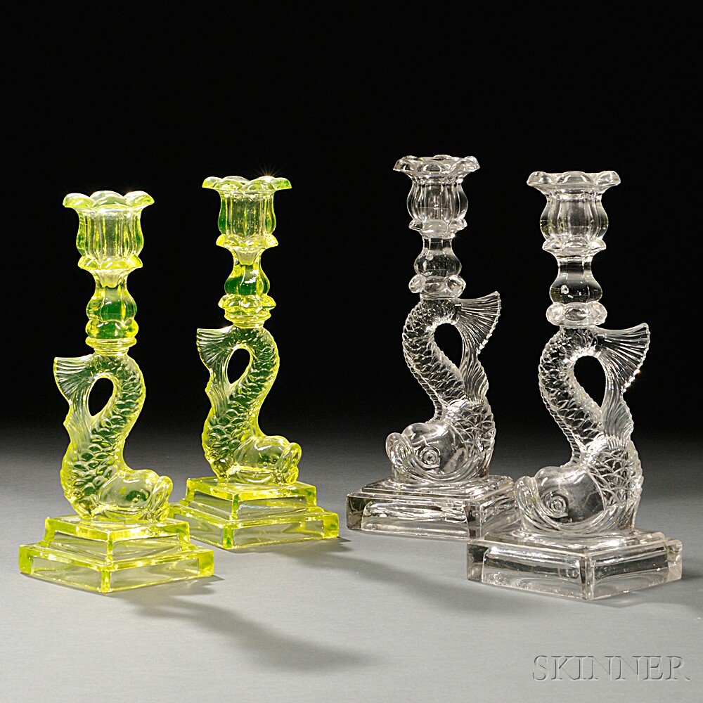 Appraisal: Two Pairs of Pressed Glass Dolphin Candlesticks probably th century