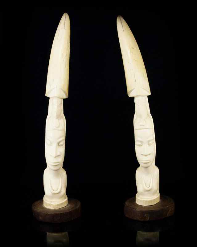 Appraisal: PAIR CARVED AFRICAN IVORY TUSKS Each portrait bust carved from