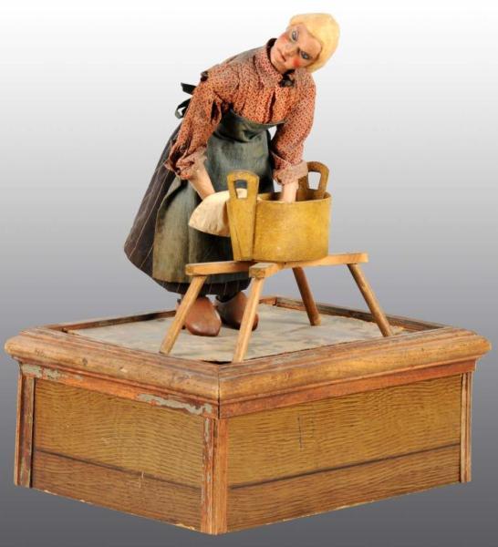 Appraisal: Wooden Washing Woman Automaton Description Circa Working Nice detail to