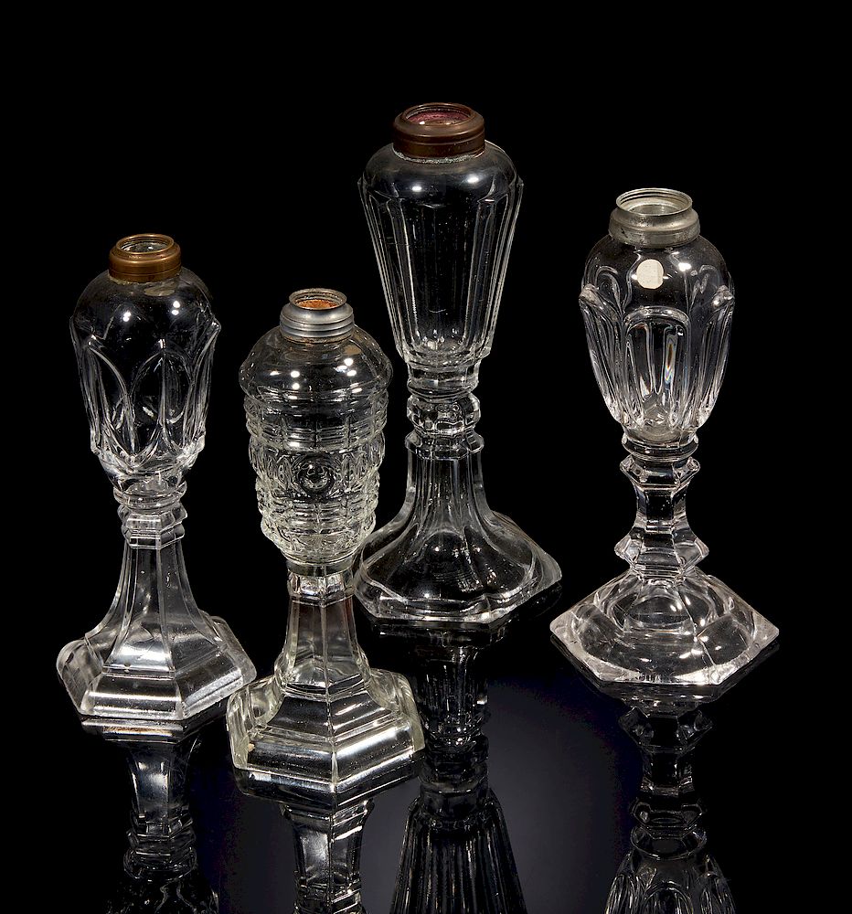 Appraisal: Four Oil Lamp Bases Four clear glass oil lamp bases