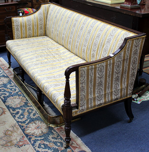 Appraisal: A TH CENTURY MAHOGANY GOLD UPHOLSTERED SETTEE the arms with