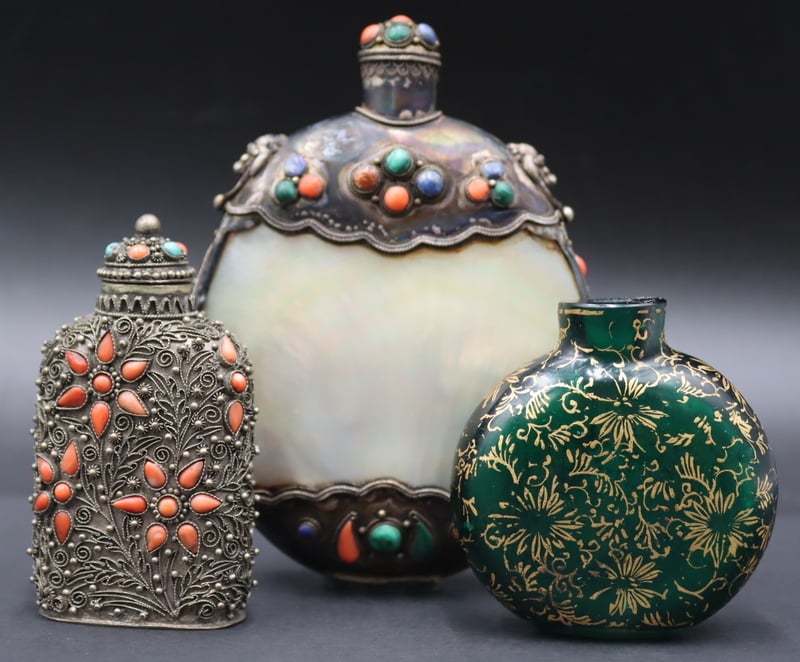 Appraisal: EMBELLISHED SNUFF BOTTLES Includes a green glass snuff bottle with