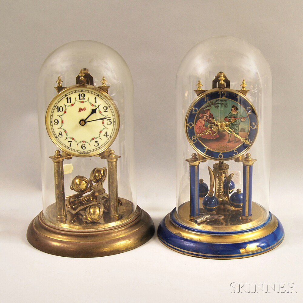 Appraisal: Two Schatz Anniversary Clocks Germany both with domes Arabic dials