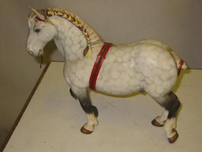 Appraisal: A BESWICK POTTERY HORSE Percheron modelled walking with plaited mane