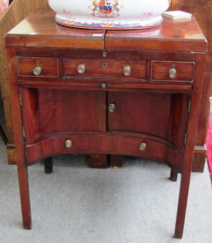 Appraisal: A George III mahogany gentleman's washstand the fold out top