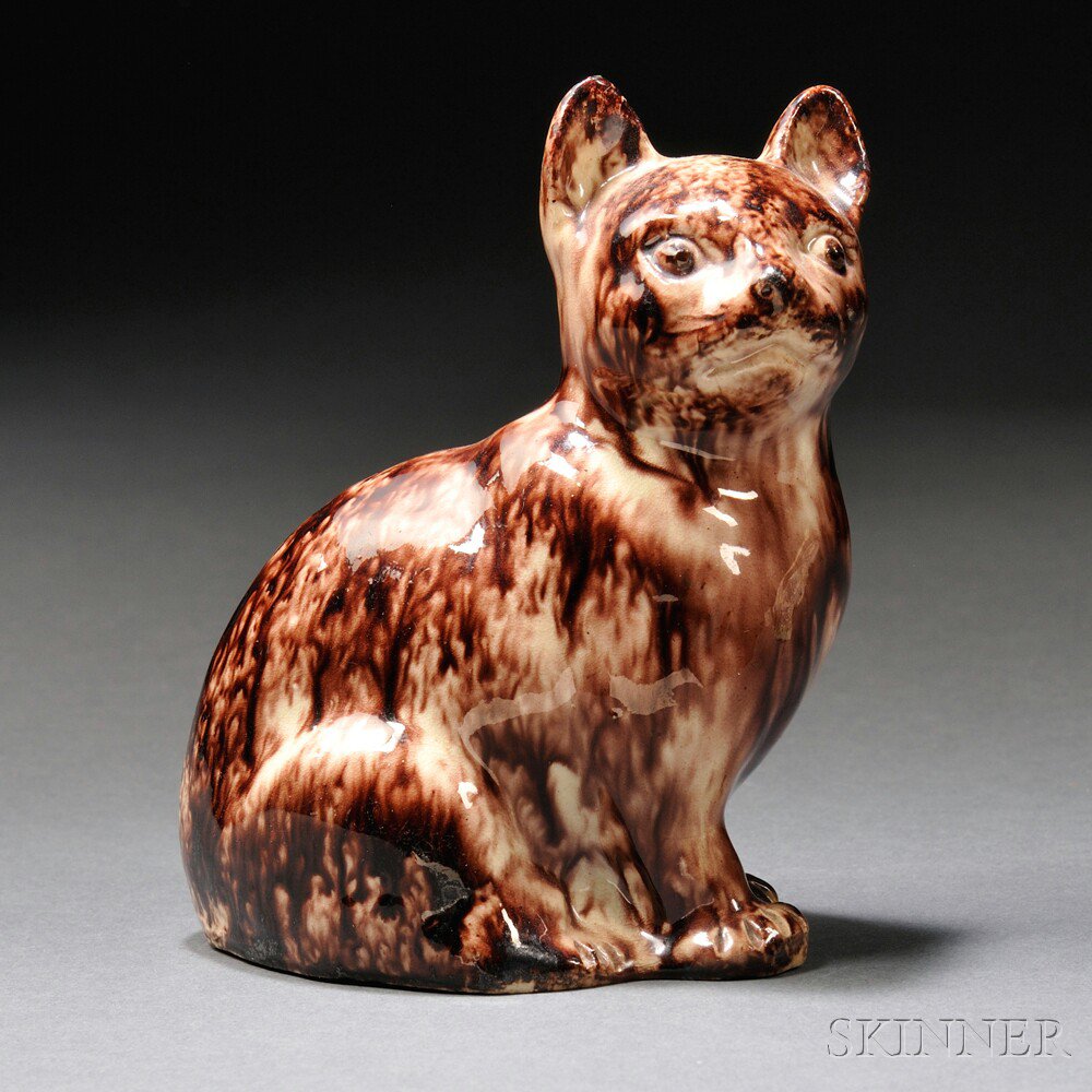 Appraisal: Staffordshire Cream-colored Earthenware Model of a Seated Cat England c