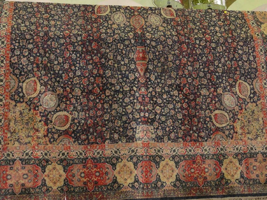 Appraisal: A Middle Eastern design carpet with a central floral round