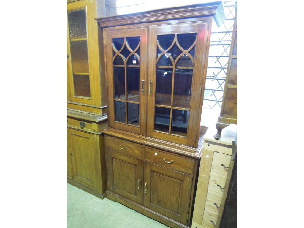 Appraisal: A contemporary hardwood display cabinet the upper section enclosed by