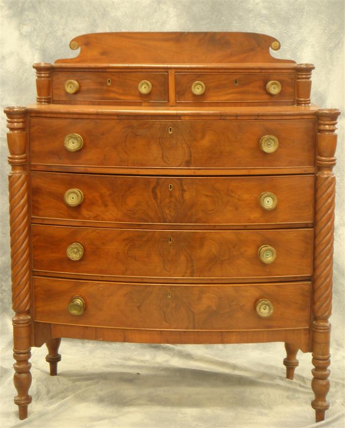 Appraisal: Mahogany bowfront turret corner New England Sheraton chest refinished nicely