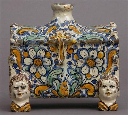 Appraisal: ITALIAN RENAISSANCE-STYLE MAJOLICA CASKET-FORM BOTTLE Of block-form with molded handles