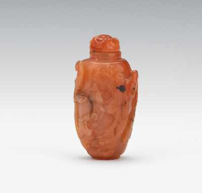 Appraisal: A Carved Agate Snuff Bottle Warm color natural agate carved