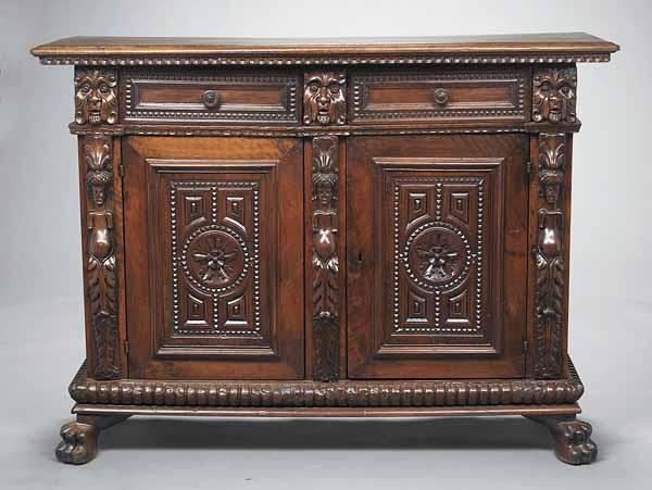 Appraisal: An Italian Carved Walnut Credenza th c two drawers over