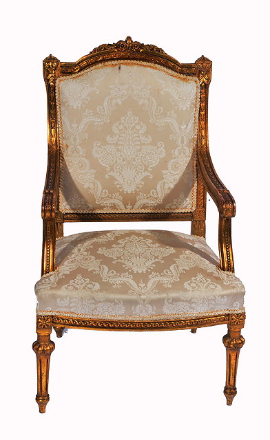 Appraisal: A LOIUS XVI STYLE GILDED OPEN ARMCHAIR with upholstered back