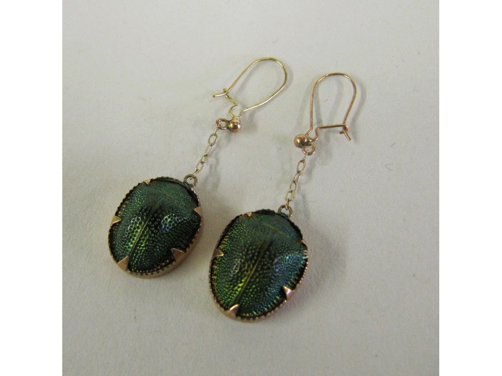 Appraisal: Pair of ct gold mounted scarab beetle drop earrings