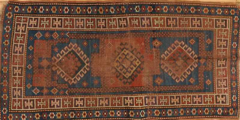 Appraisal: CAUCASIAN RUG Worked with hooked ivory and terracotta diamonds anchored