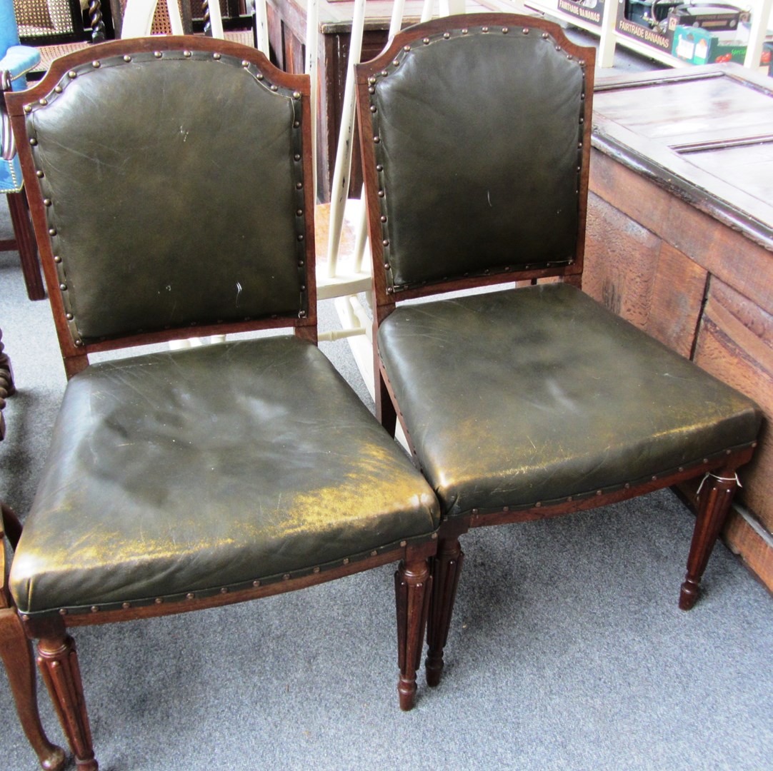 Appraisal: A pair of th century rosewood framed leather upholstered side