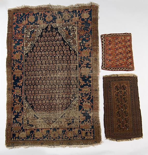 Appraisal: THREE AREA RUGS All small tribal rugs probably Persian smallest