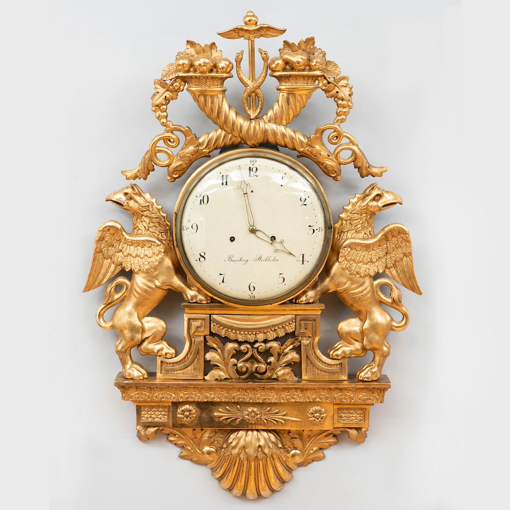 Appraisal: Swedish Neoclassical Giltwood Cartel Clock The painted dial signed Beurling