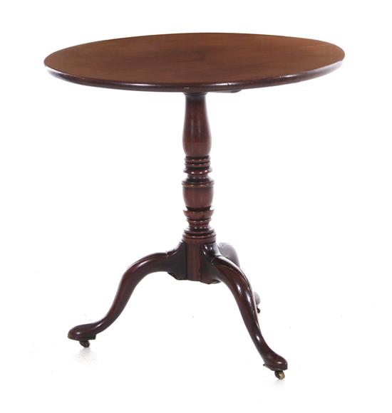 Appraisal: George III mahogany tilt-top table circa round top turned pedestal