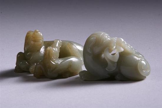 Appraisal: TWO CHINESE CELADON JADE CARVINGS One of two recumbent horses