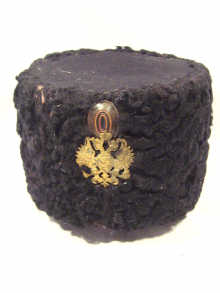 Appraisal: Russian Interest A Russian black astrakhan hat with a brass