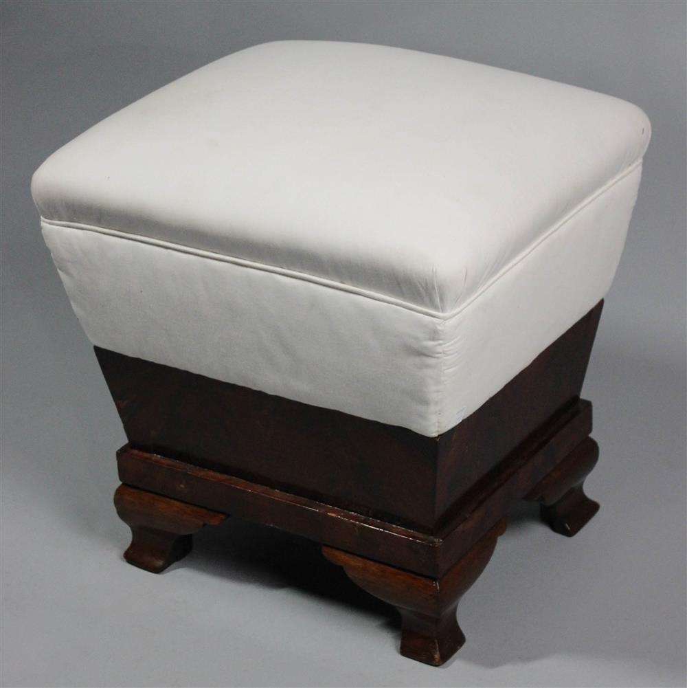 Appraisal: CLASSICAL STYLE MAHOGANY FOOTSTOOL rectangular upholstered foot rest above mahogany