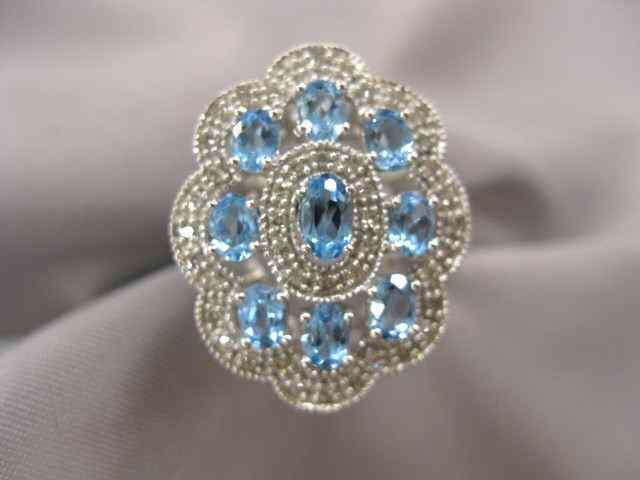 Appraisal: Blue Topaz Diamond Ring oval gems surrounded by diamonds in