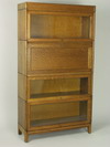 Appraisal: BOOKCASE - Four section golden oak stacking Barrister bookcase consists