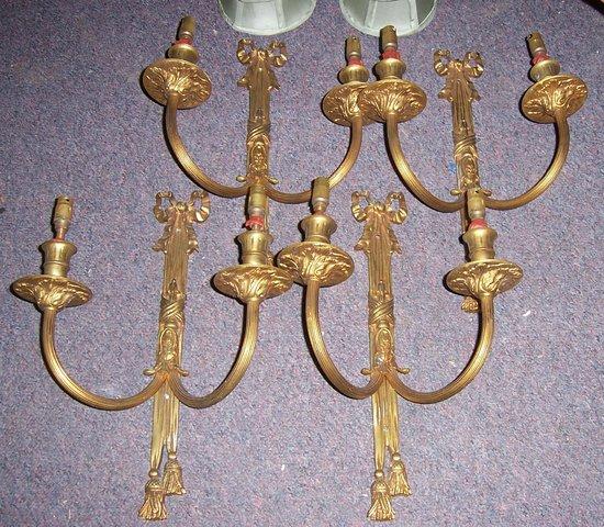 Appraisal: Four brass two-branch wall lights in Louis XVI style