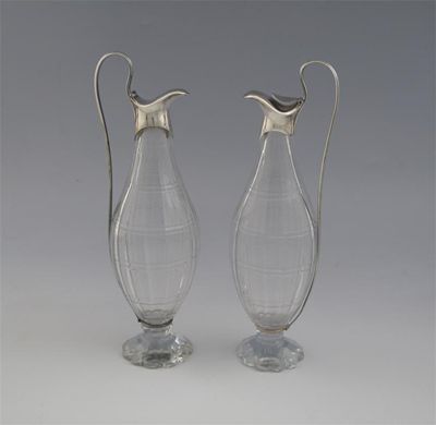 Appraisal: A pair of mounted glass oil and vinegar bottles reeded