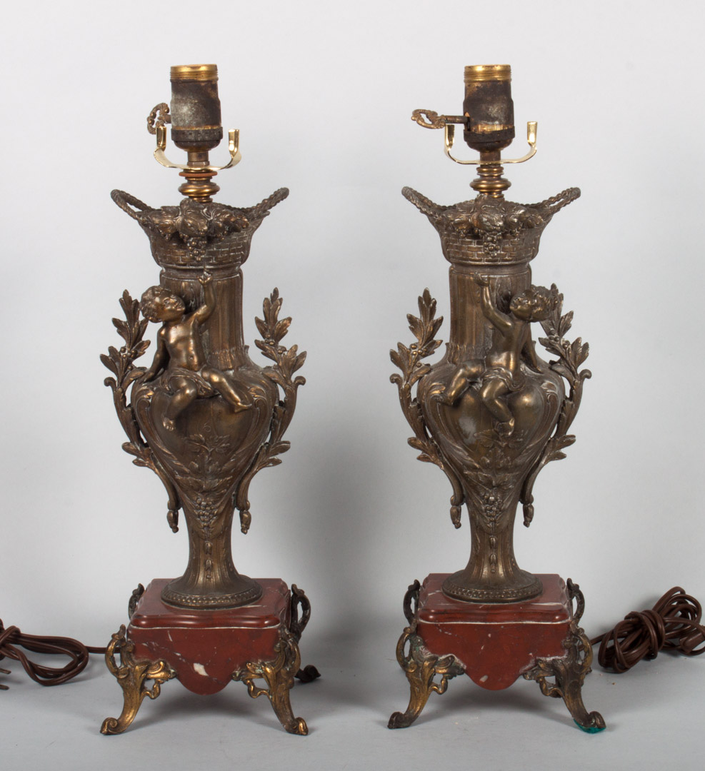 Appraisal: Pair of Rococo style spelter figural vase lamps vase with