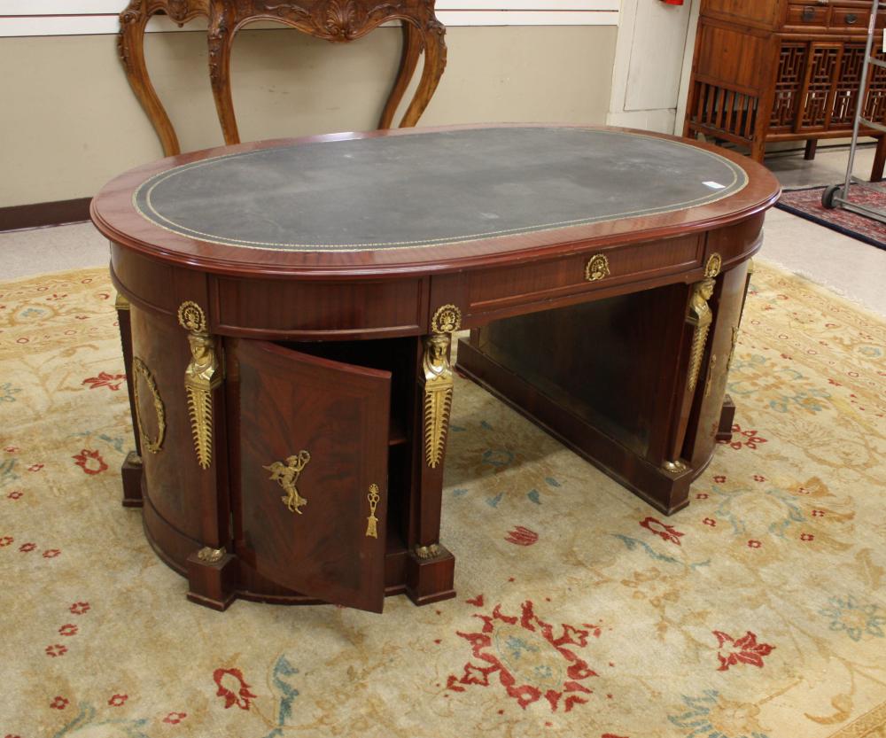 Appraisal: OVAL ORMOLU-MOUNTED MAHOGANY PARTNERS' DESK French Empire style th century