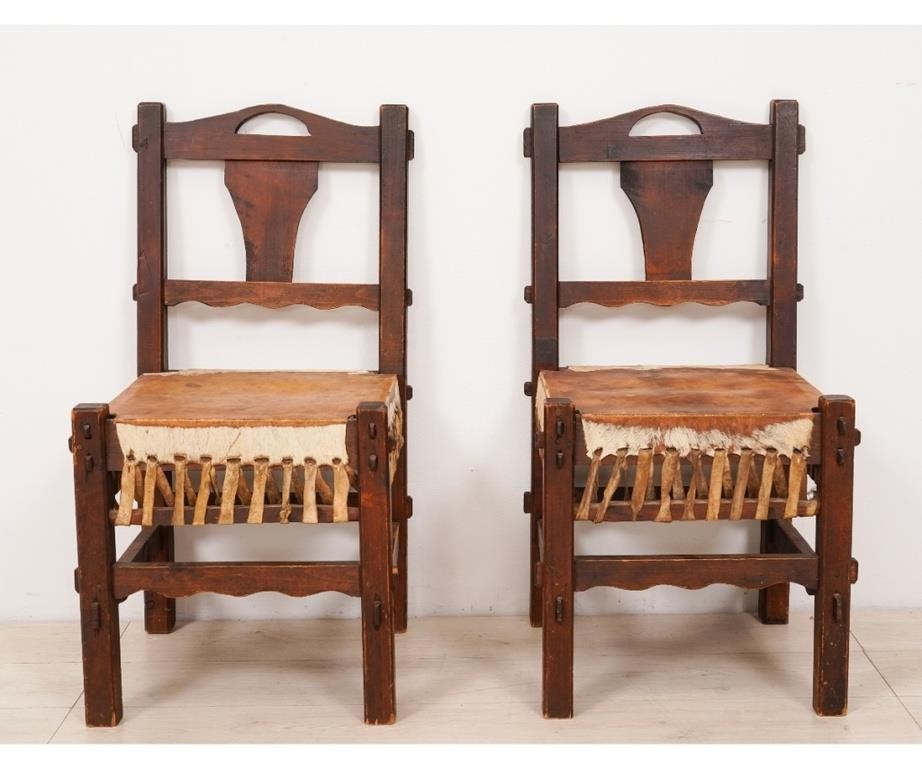 Appraisal: Pair of Arts Crafts oak side chairs with stretched cow