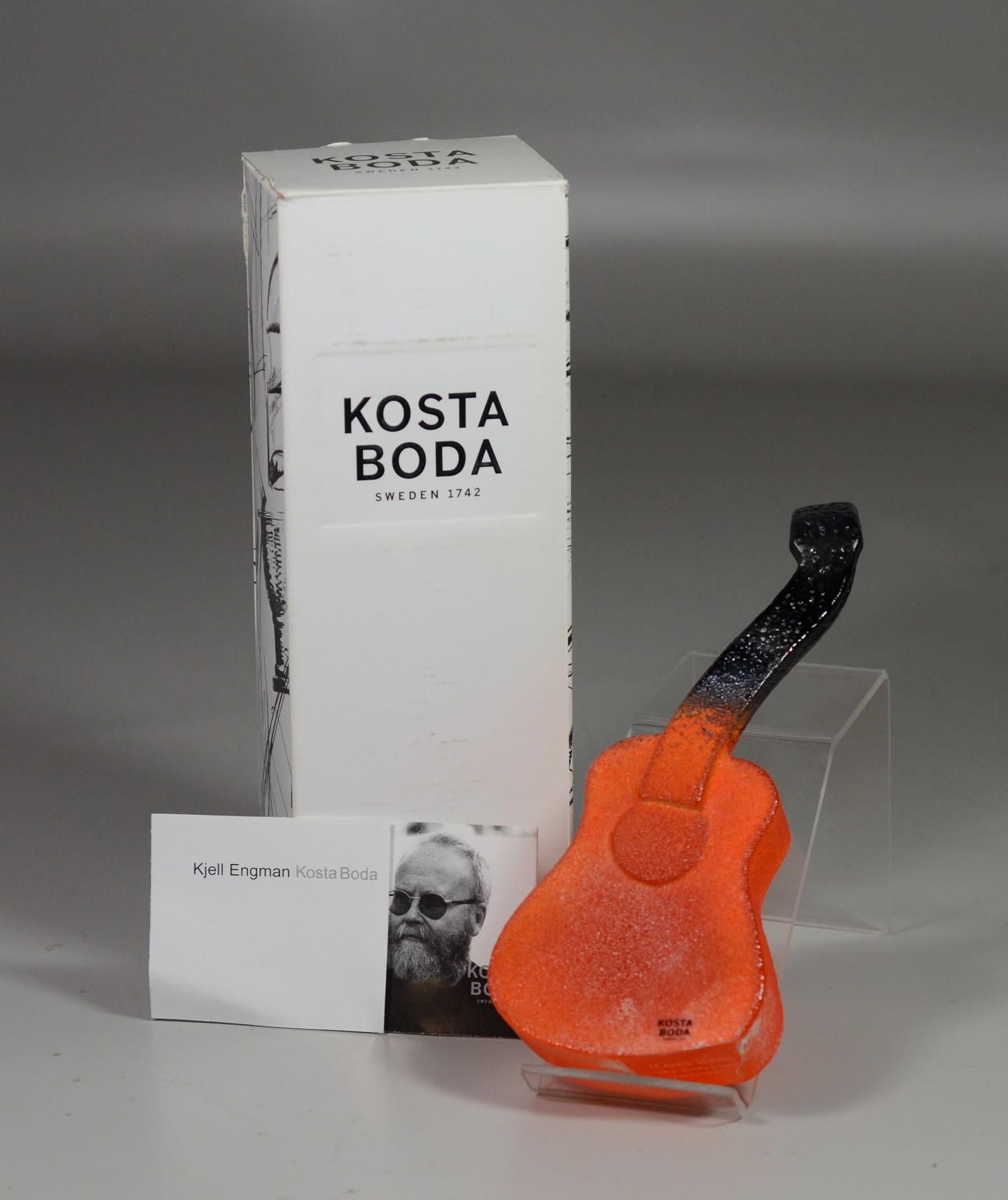 Appraisal: Kosta Boda Art Glass Orange Guitar Sculpture new with original