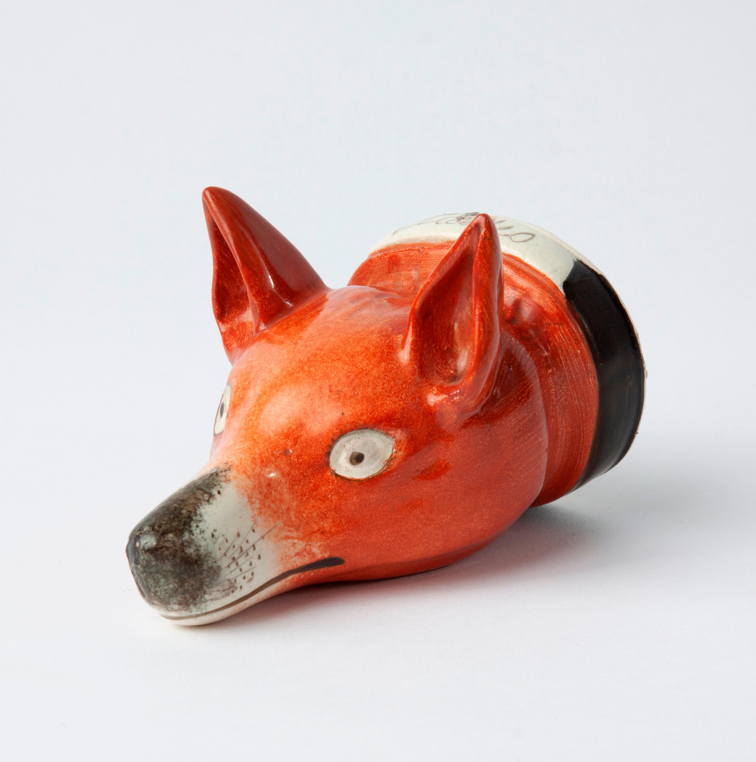 Appraisal: TH C STAFFORDSHIRE POTTERY FOX STIRRUP CUP A th c