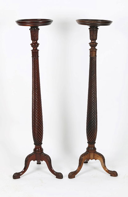 Appraisal: A PAIR OF VICTORIAN MAHOGANY TORCHERES each with rope twist